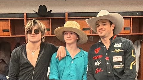 Timothy in a straw hat at a rodeo